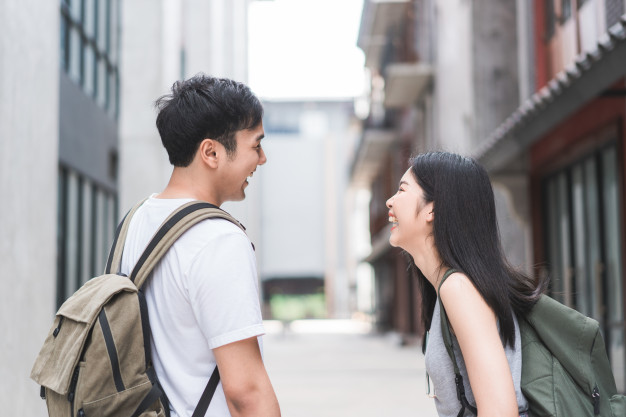 Traveler asian backpacker couple feeling happy traveling in beijing