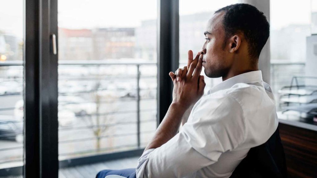 man thinking at work place