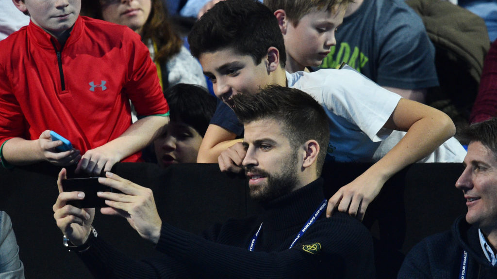 Barcelona defender Gerard Pique takes a selfie with a fan