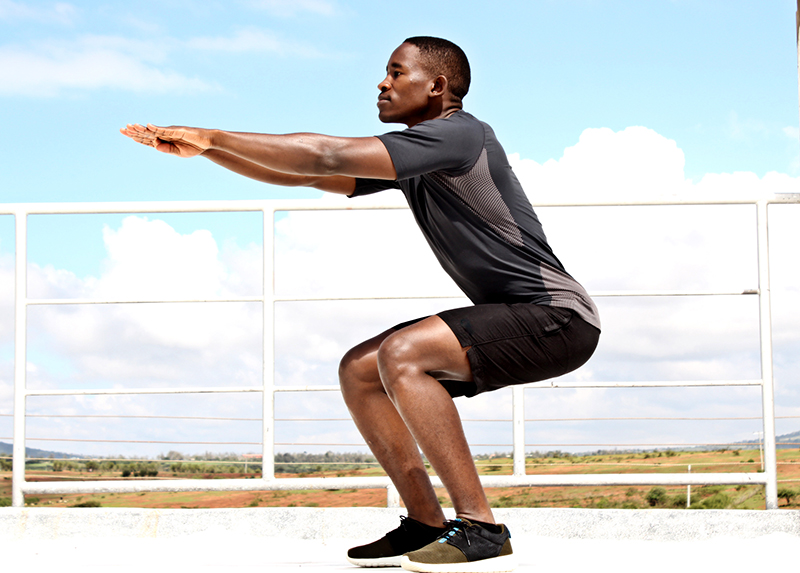 Side-View-of-Man-Doing-Squats