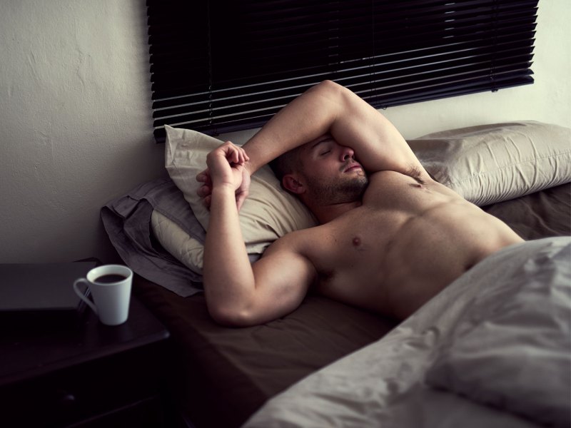 Shirtless Man Sleeping on Bed