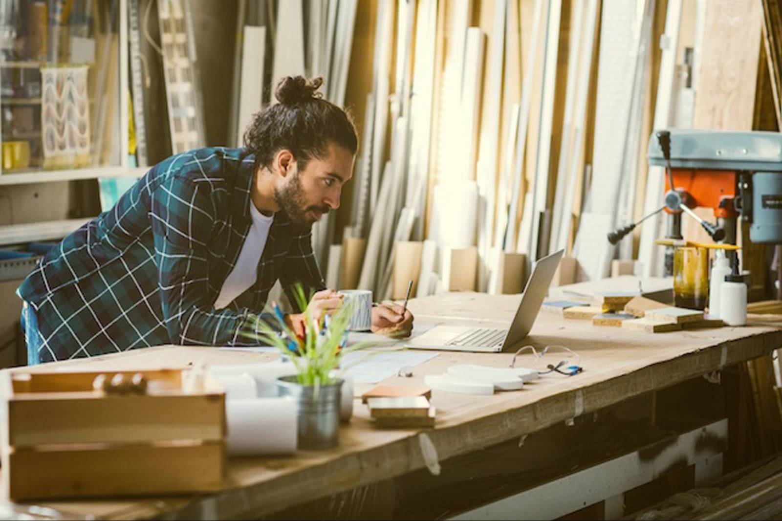 Man entrepreneur looking at laptop 