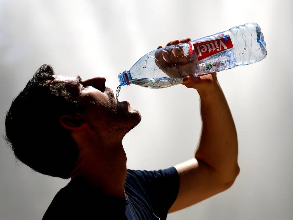Man Drinking Water Bottle  