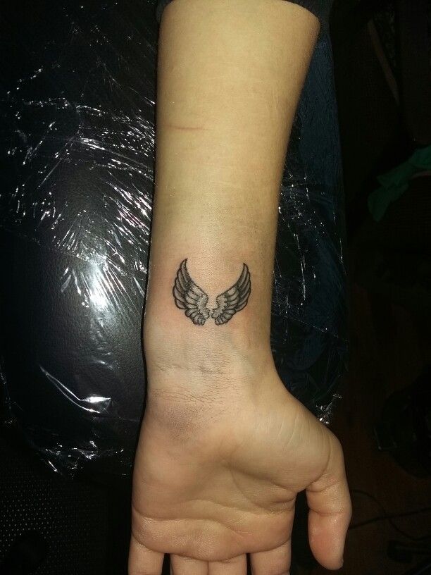 Small wings tattoo on hand