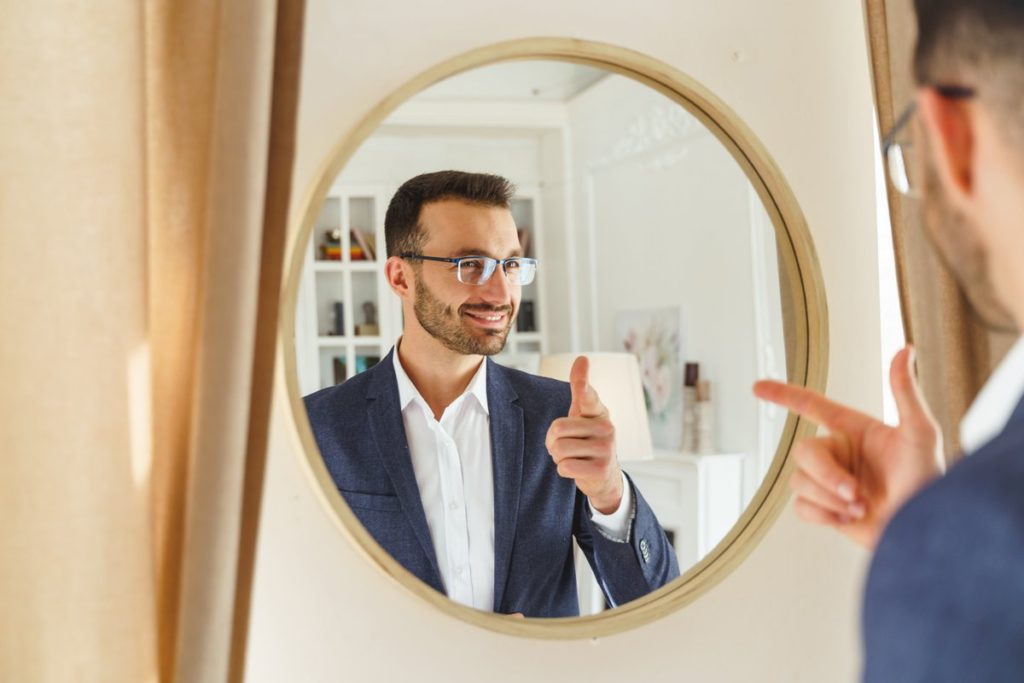 Man Looking In Mirror 