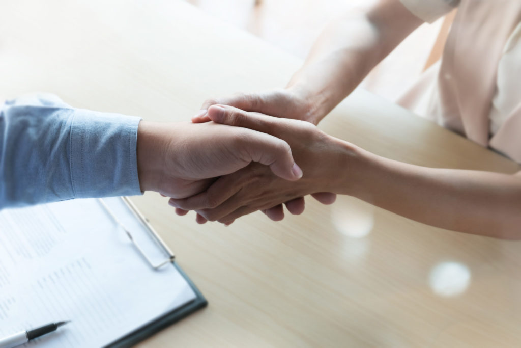 shaking hands as a thank you gesture