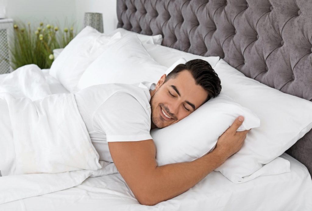 Man Sleeping on Bed 