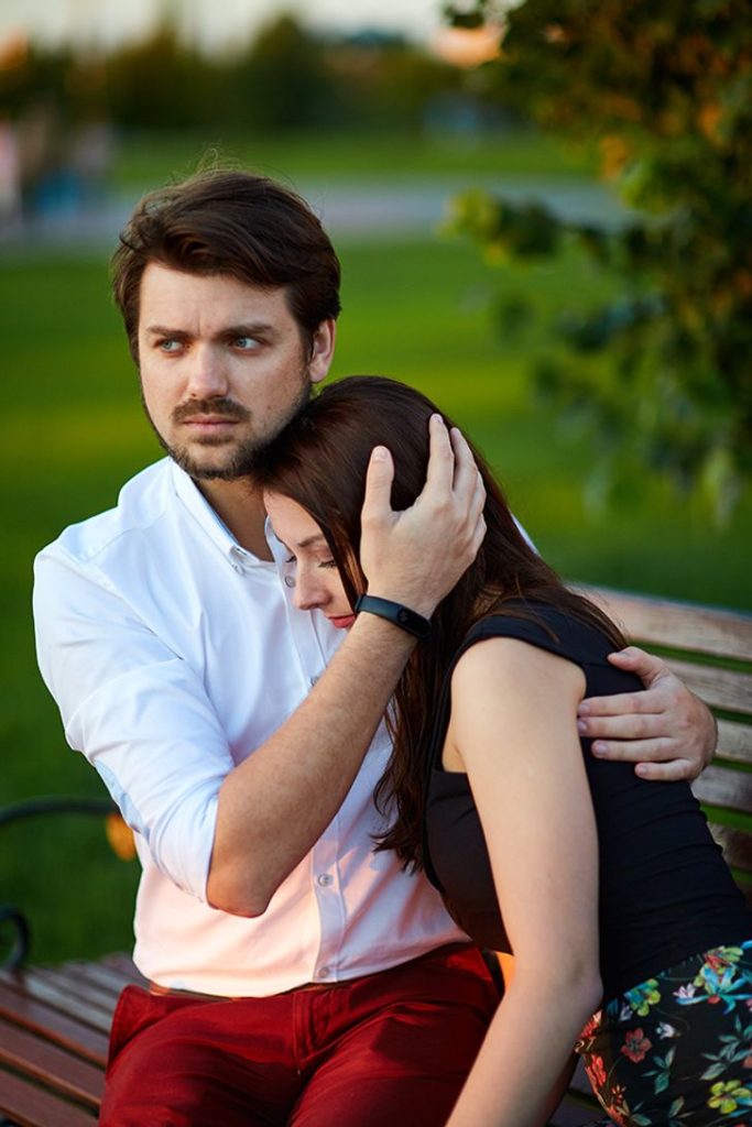 man hugging his girlfriend 