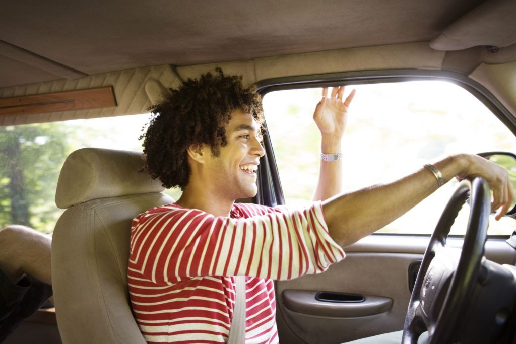  Happy Young Man Driving Car And Smiling 