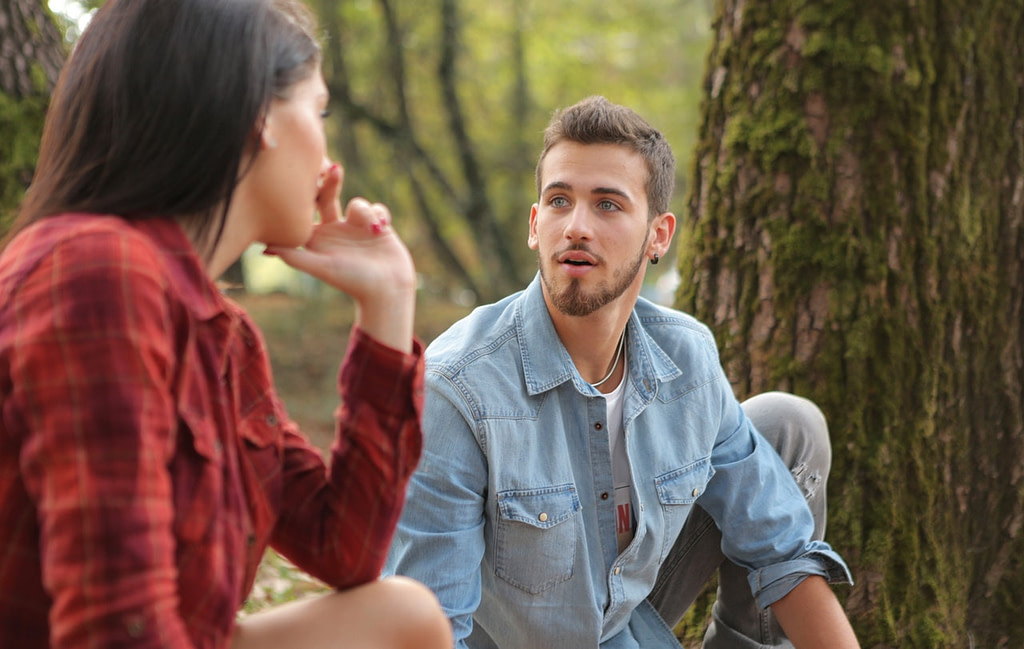  young woman and man talking together 