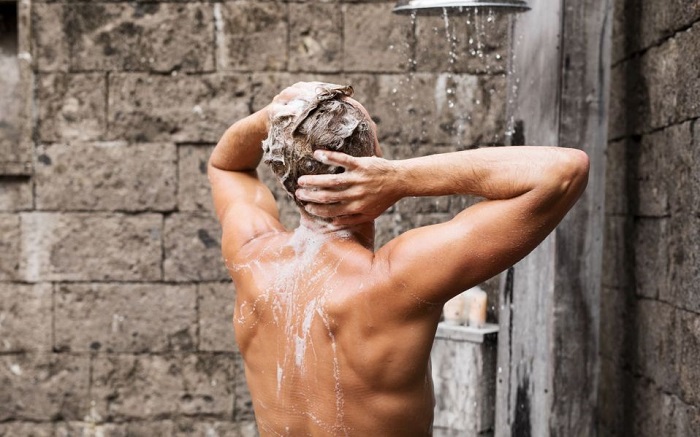 Man taking shower and hair washing 