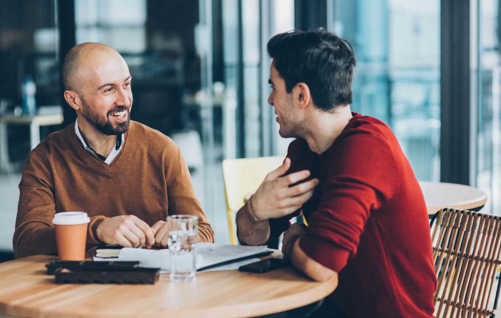 Two Men Talking at coffee shop 