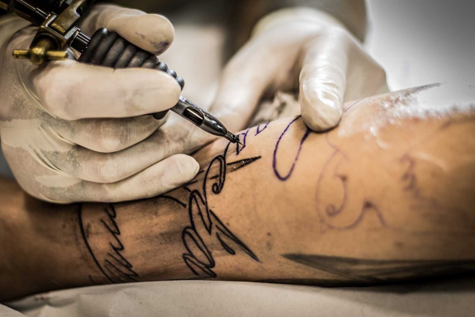 Tattooed Man Getting New Tattoo 