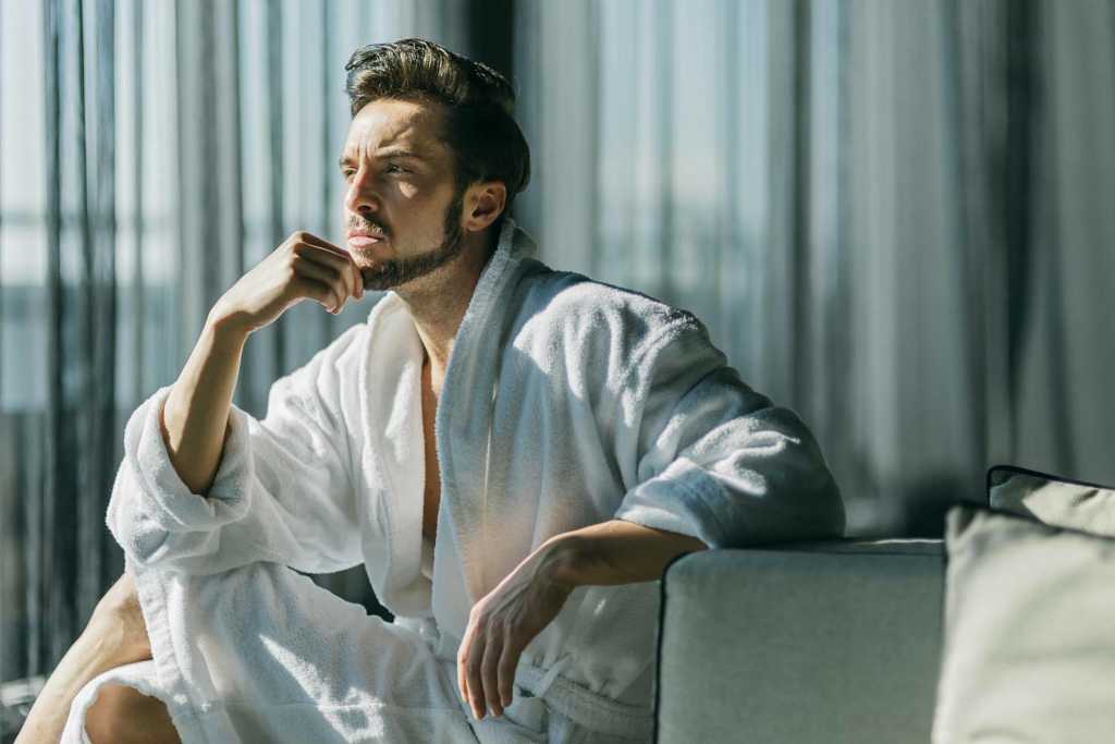 Man sitting and thinking in the morning 