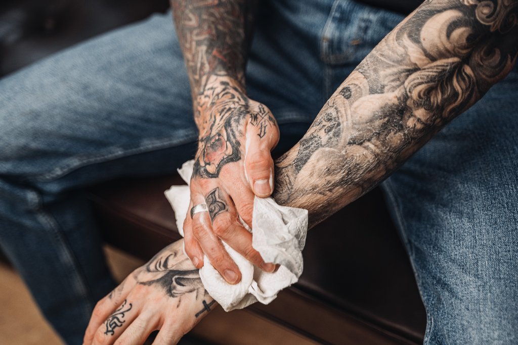  man Cleaning a Tattoo