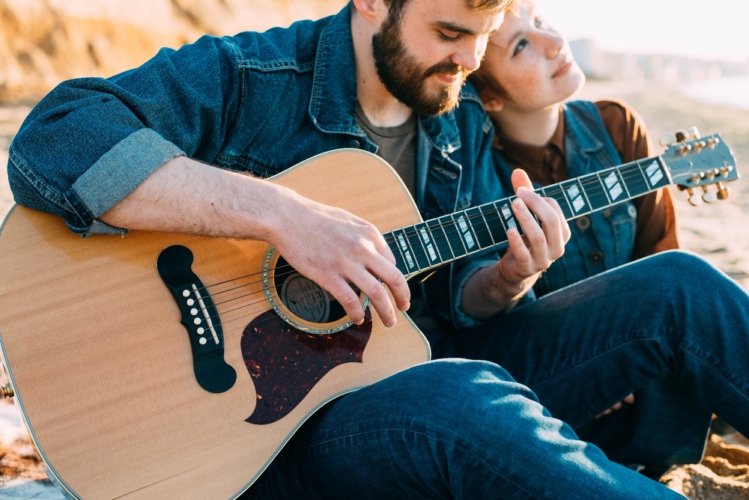  Couple playing guitar 