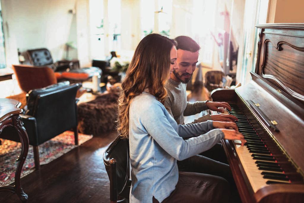 couple playing Piano