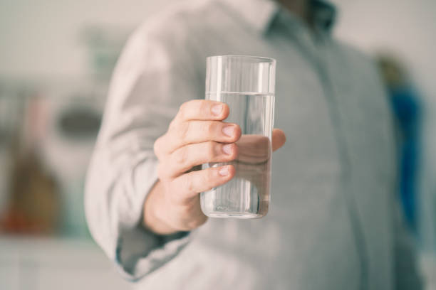 Man Holding Glass Of Water