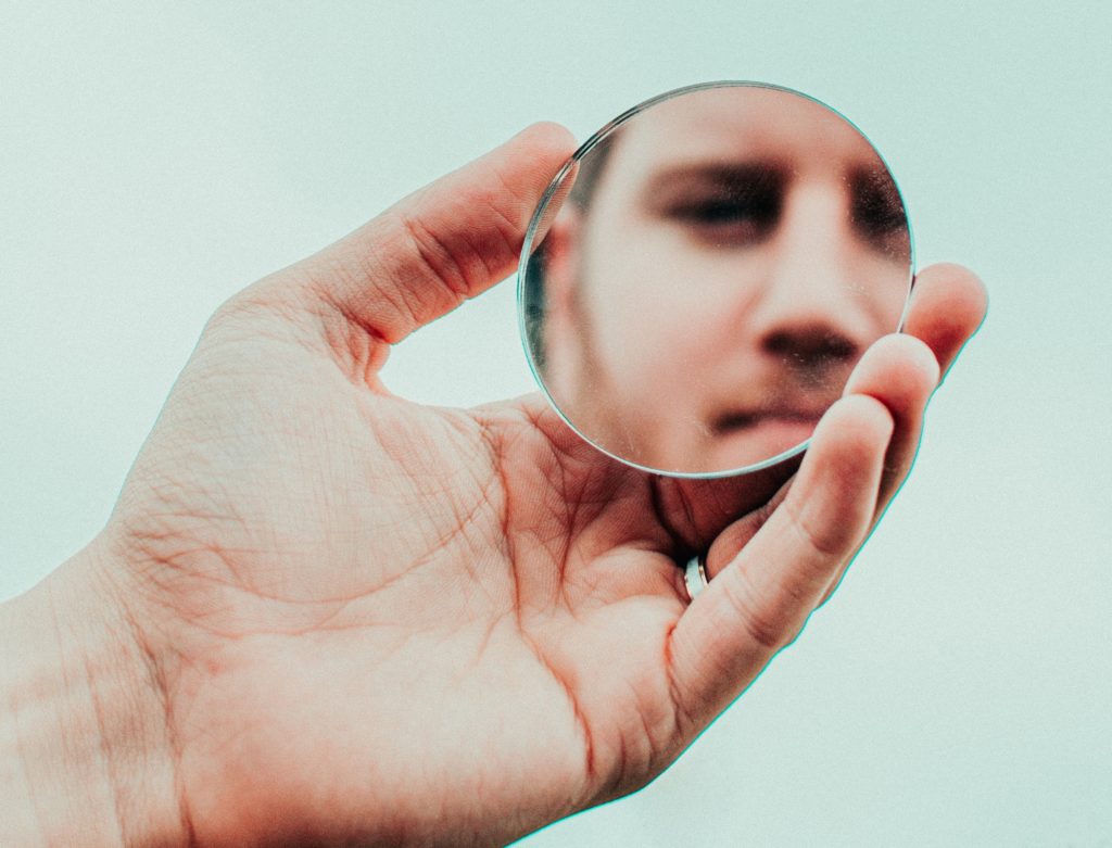 man looking at the mirror 
