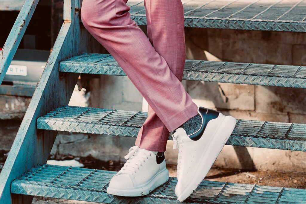 man-wearing-pink-suit-wearing-sneakers-pexels