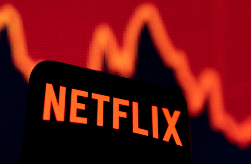 FILE PHOTO: Smartphone with Netflix logo is seen in front of a descending stock graph in this illustration taken April 19, 2022. REUTERS/Dado Ruvic/Illustration/File Photo