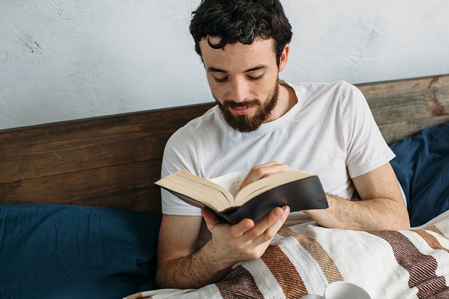 man reading book