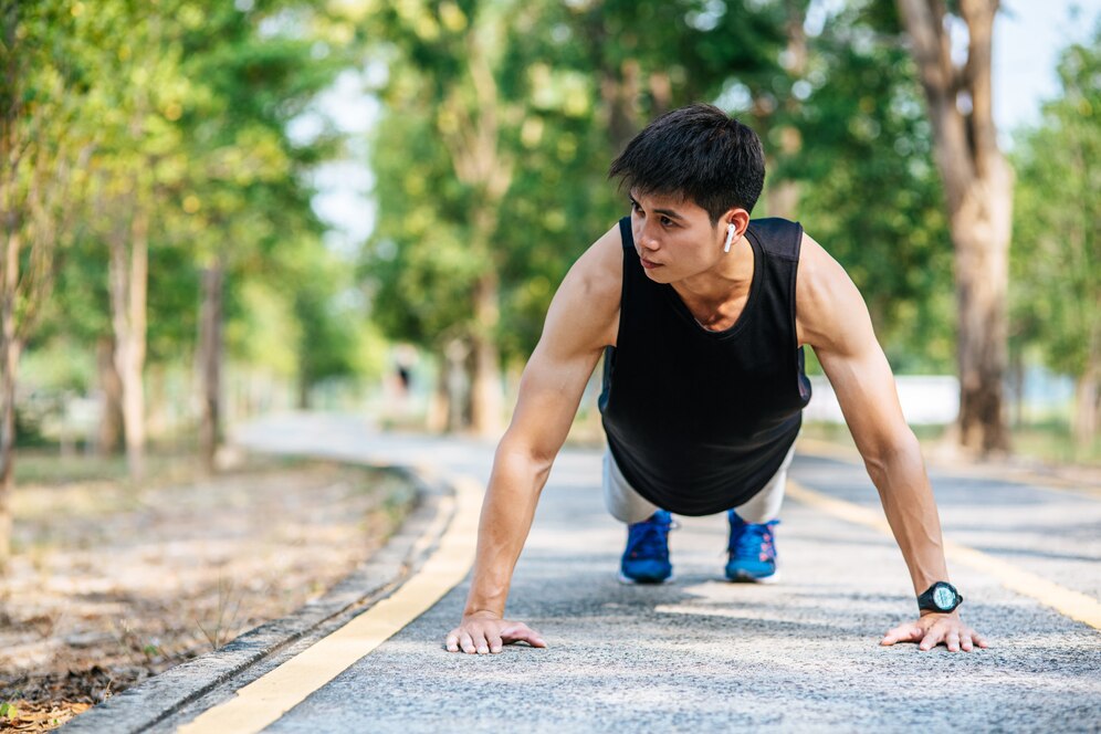 men wear black shirts with muscles push up on the street