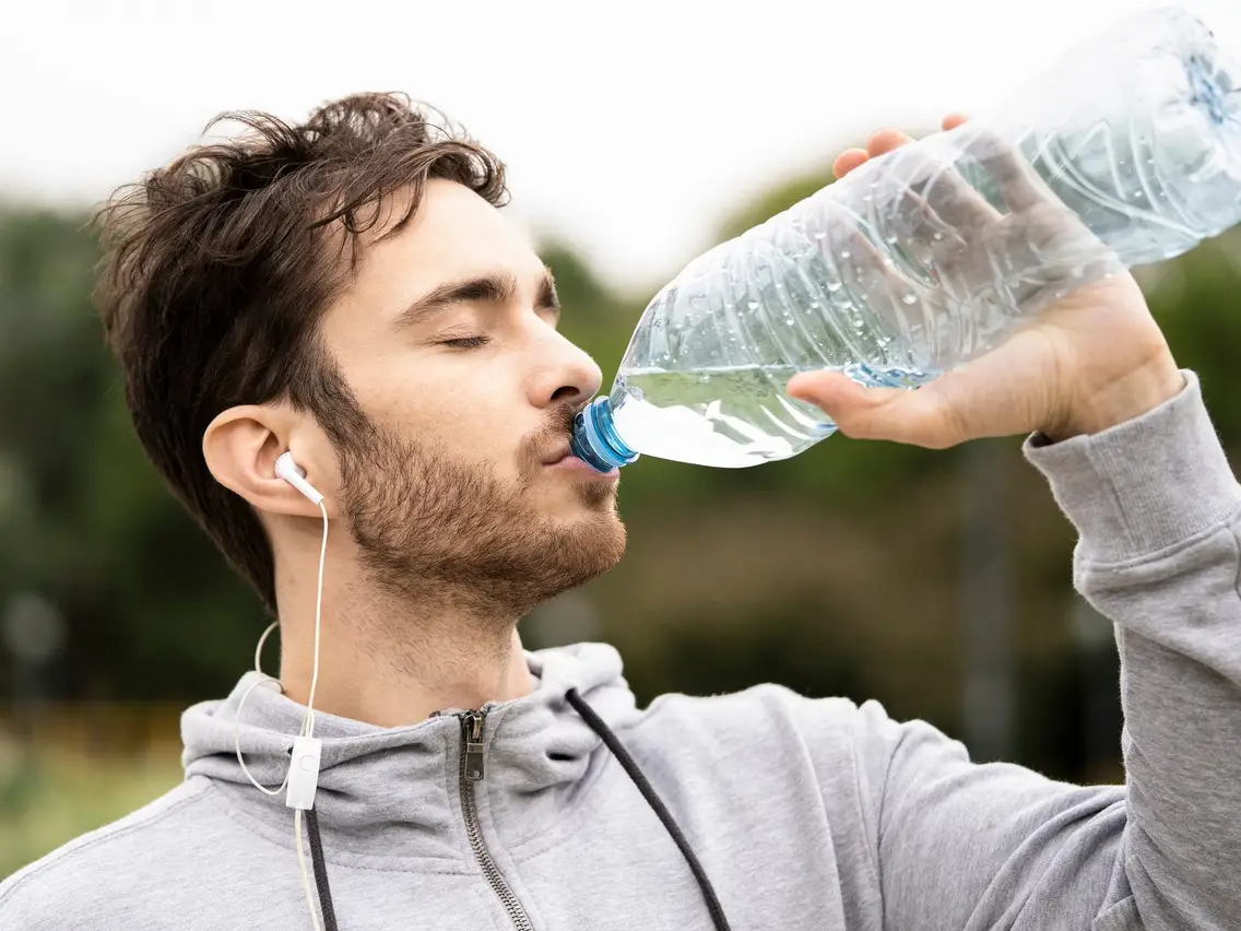 man drinking water 