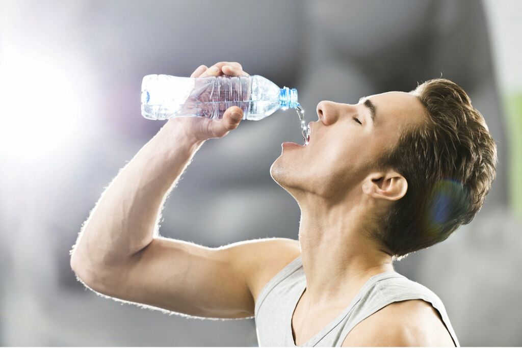 man drinking water 