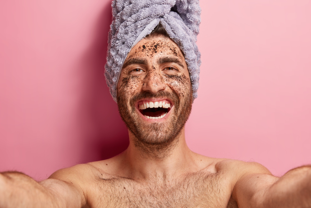 man using body scrub