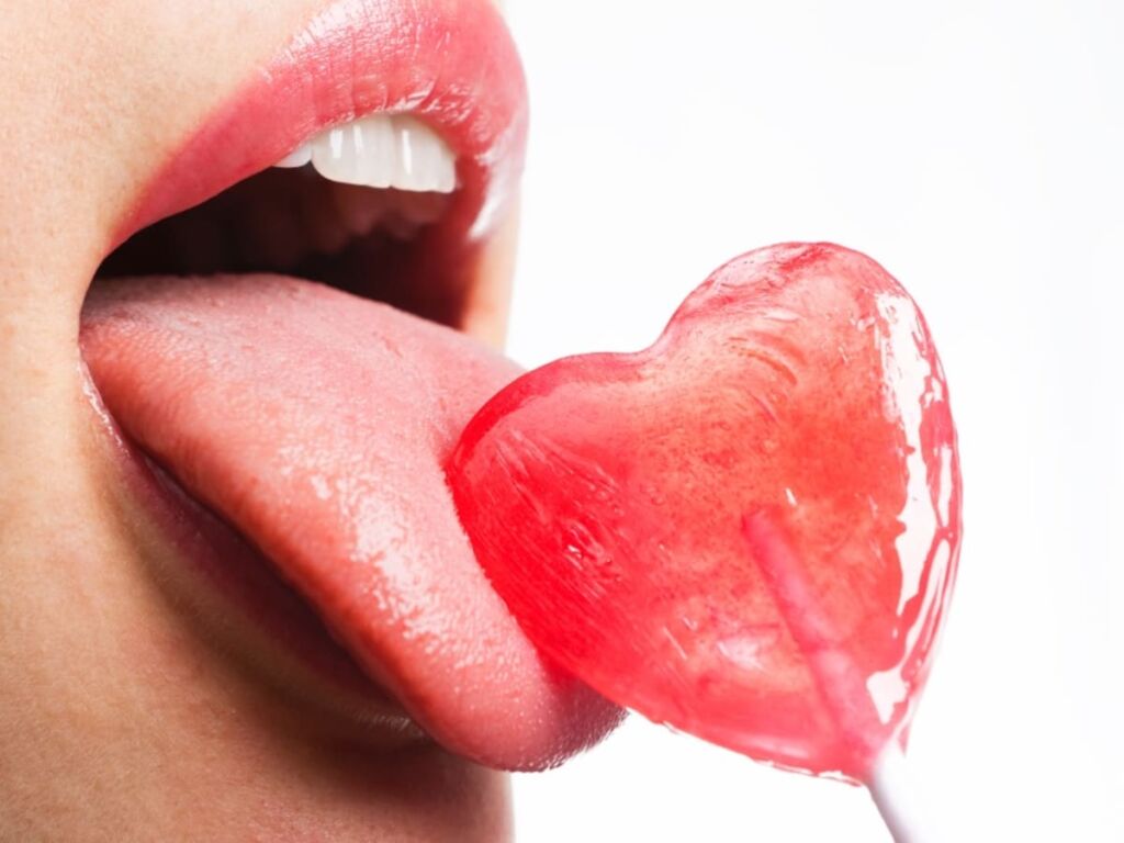 female lips with lollipop