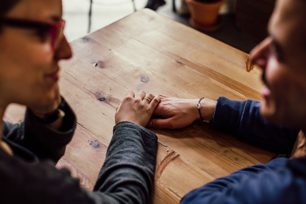 Couple Talking In Cafe