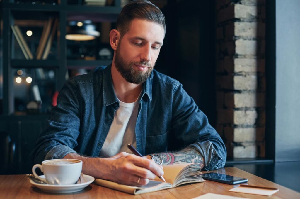 man taking notes 