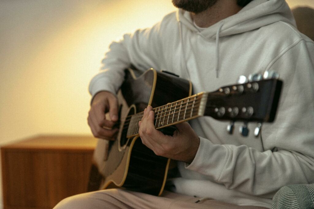 A Person Playing a Guitar