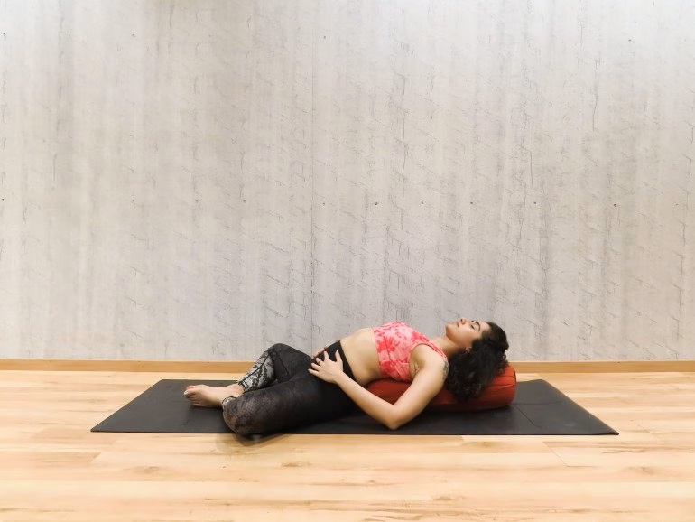 Supta Baddha Konasana (Reclining Bound Angle pose)