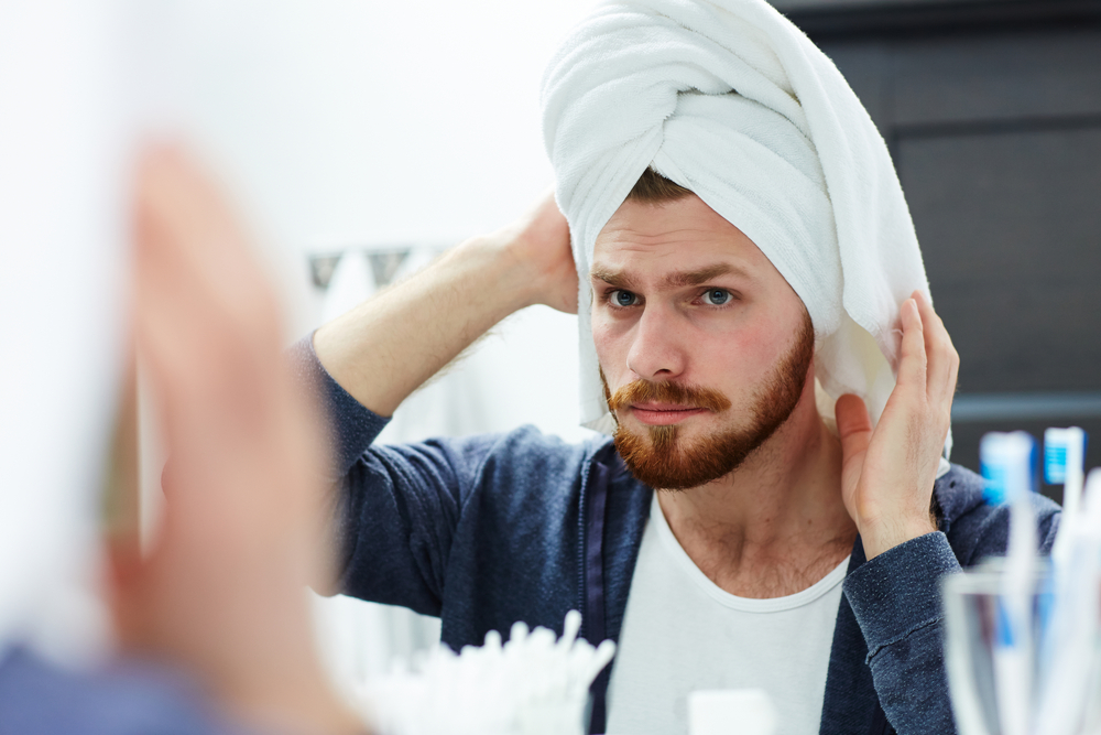 Man Drying His Hair With A Towel
